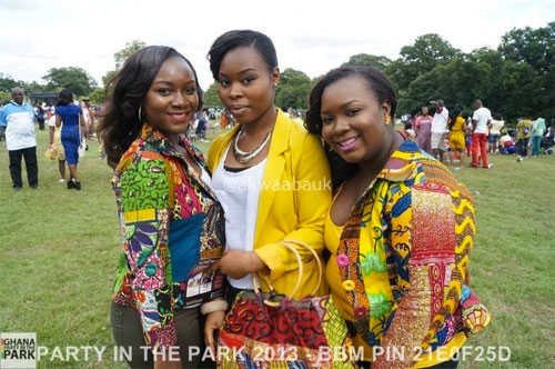 image: three young beautiful women in red green and yellow clothes | caption: PARTY IN THE PARK 2013