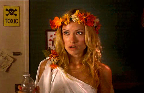 a white sorority girl with a toga and flower garland | Tacky Harper's Cryptic Clues